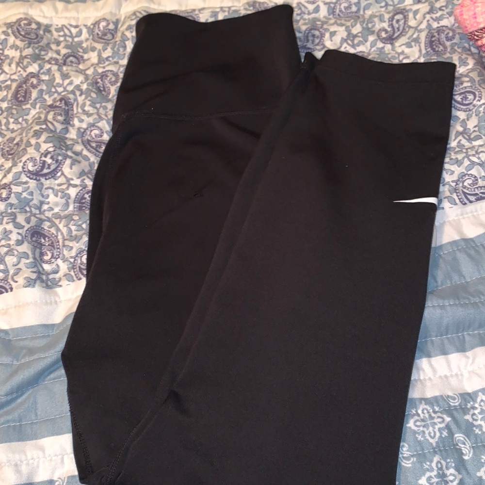NIKE black leggings. Small tear on leg